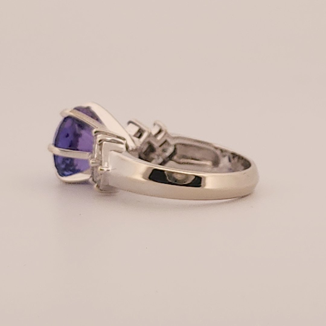 Natural Round Modified Brilliant Cut, Bluish Violet Tanzanite (5.25 CT - 10.20 mm) with 12 Natural Princess cut 3x3 mm Square Diamonds (1.92 CTW) Ring 14K White Gold. GIA Certified (2231466864).