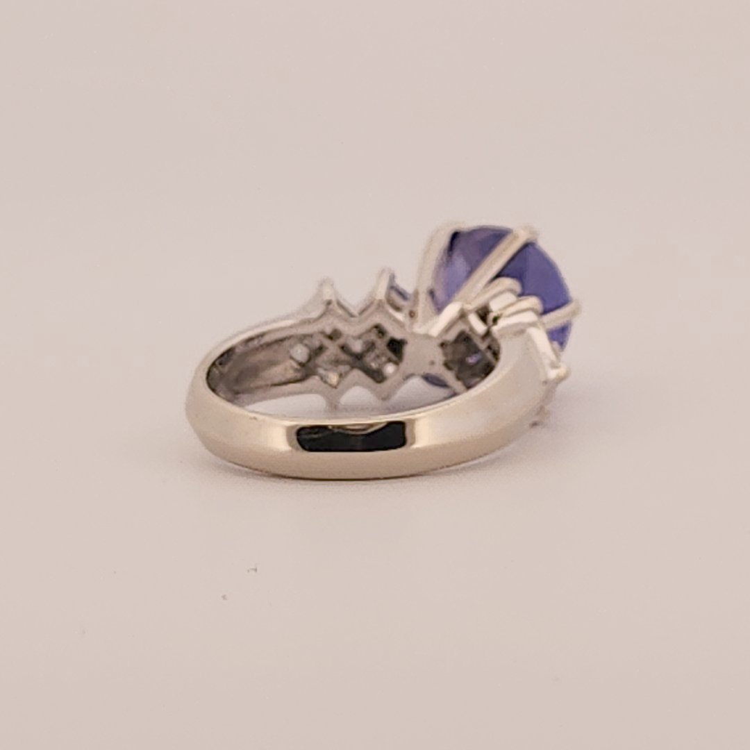 Natural Round Modified Brilliant Cut, Bluish Violet Tanzanite (5.25 CT - 10.20 mm) with 12 Natural Princess cut 3x3 mm Square Diamonds (1.92 CTW) Ring 14K White Gold. GIA Certified (2231466864).