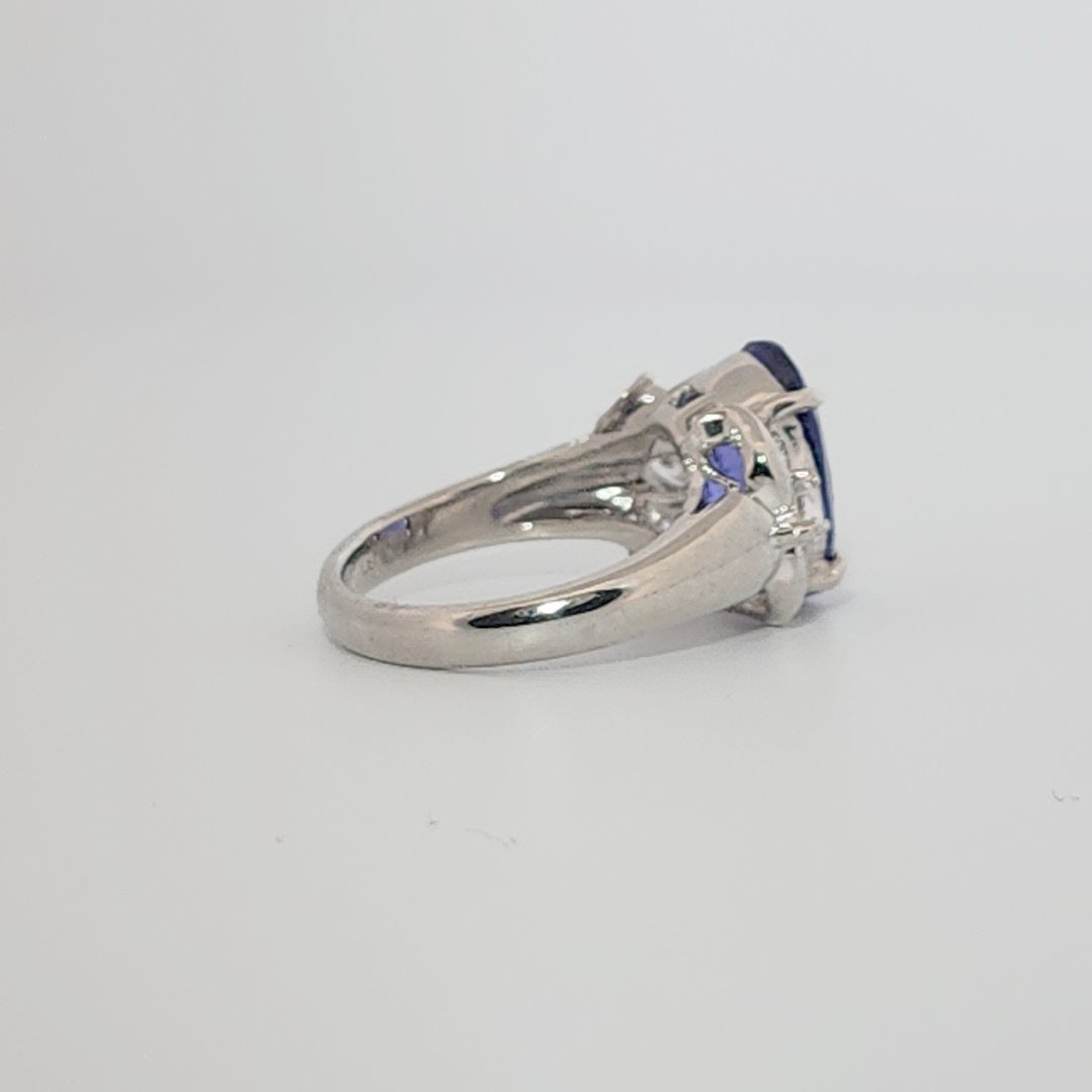 Modified Brilliant Cut, Oval Shape, Bluish Violet Tanzanite (4.38CT, 12.77 x 8.29 x 5.57 mm), Mounted at Platinum 900 Ring with Natural Diamonds (0.60 CTW, E/F-VS). GIA Certified (5232466621). Size 5.75