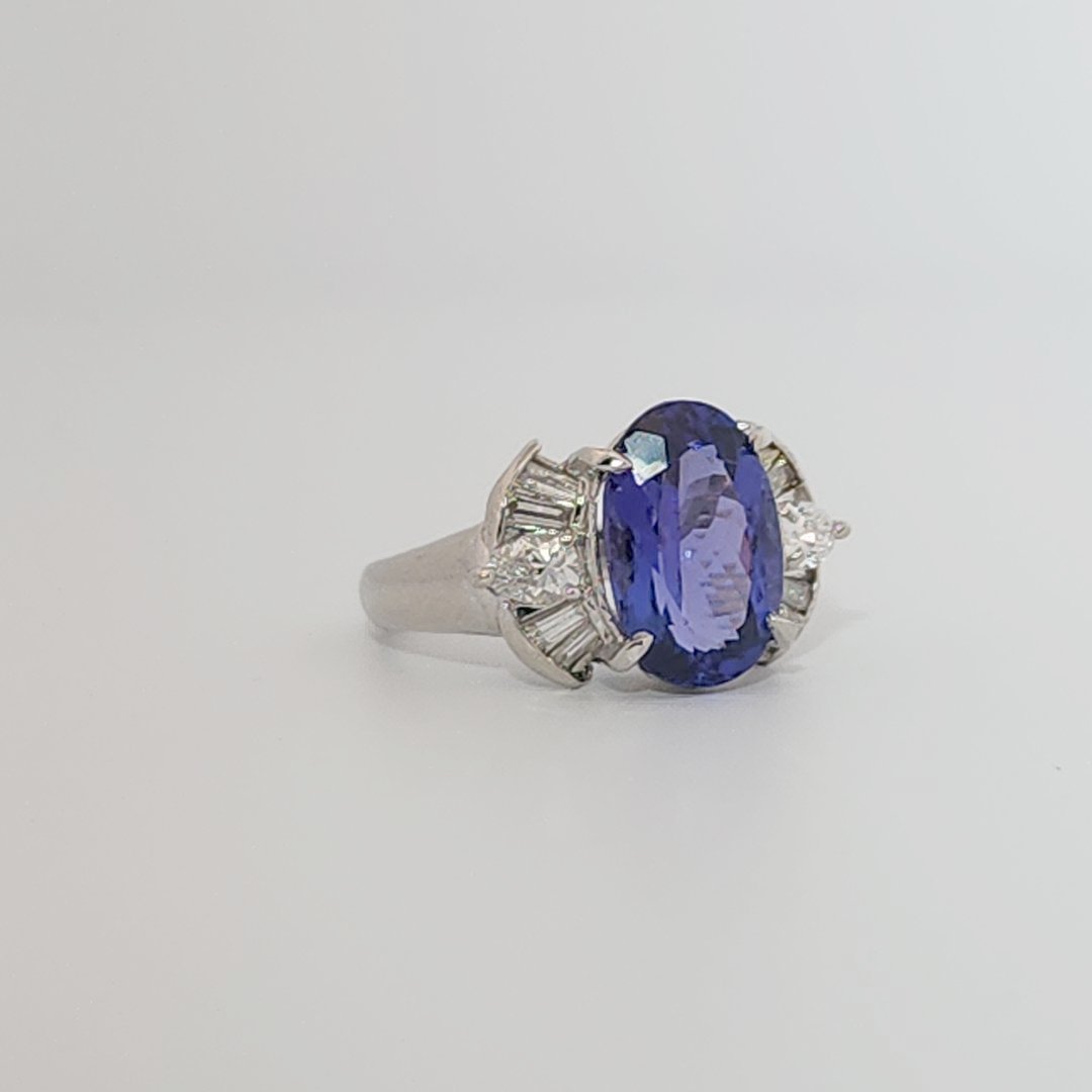 Modified Brilliant Cut, Oval Shape, Bluish Violet Tanzanite (4.38CT, 12.77 x 8.29 x 5.57 mm), Mounted at Platinum 900 Ring with Natural Diamonds (0.60 CTW, E/F-VS). GIA Certified (5232466621). Size 5.75