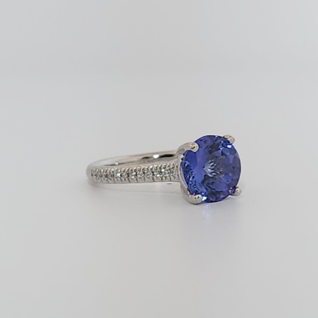 Modified Brilliant Cut, Round Shape, Bluish Violet Tanzanite (2.80CT, 8.89 - 9.01 x 5.53 mm), Mounted at Platinum 950 ring with Natural Diamonds (0.18 CTW E/F-SI). GIA Certified (5231466569). Size 5.25