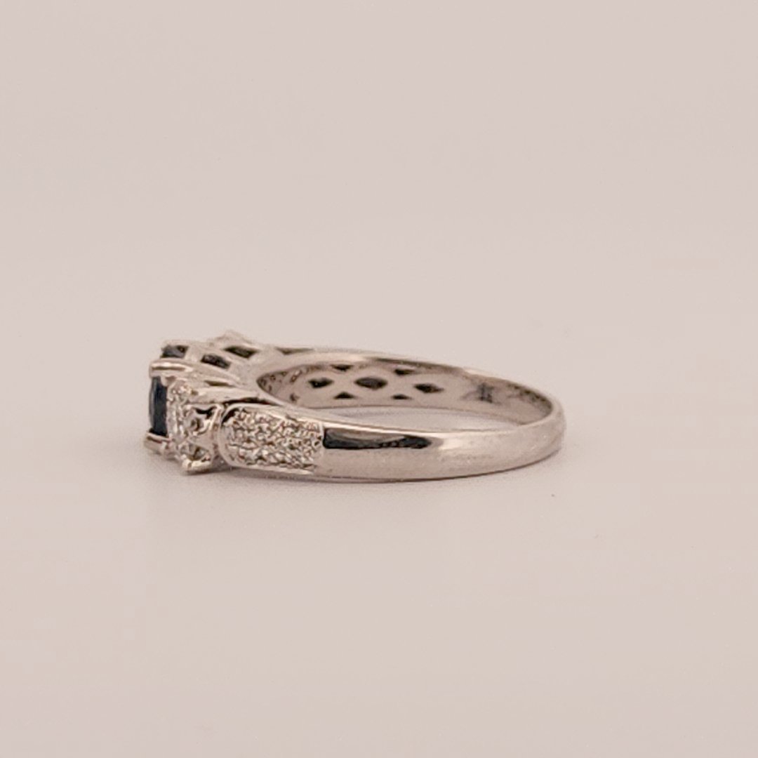 Three stone style Bridal Ring with 0.75 CT Natural Sapphire and 0.34CTW Natural Diamonds