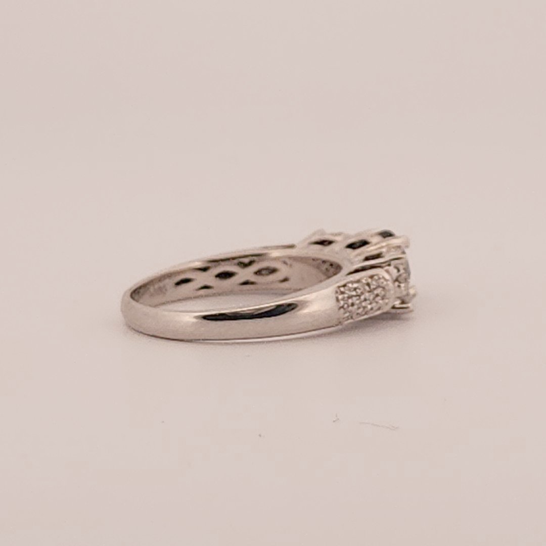 Three stone style Bridal Ring with 0.75 CT Natural Sapphire and 0.34CTW Natural Diamonds