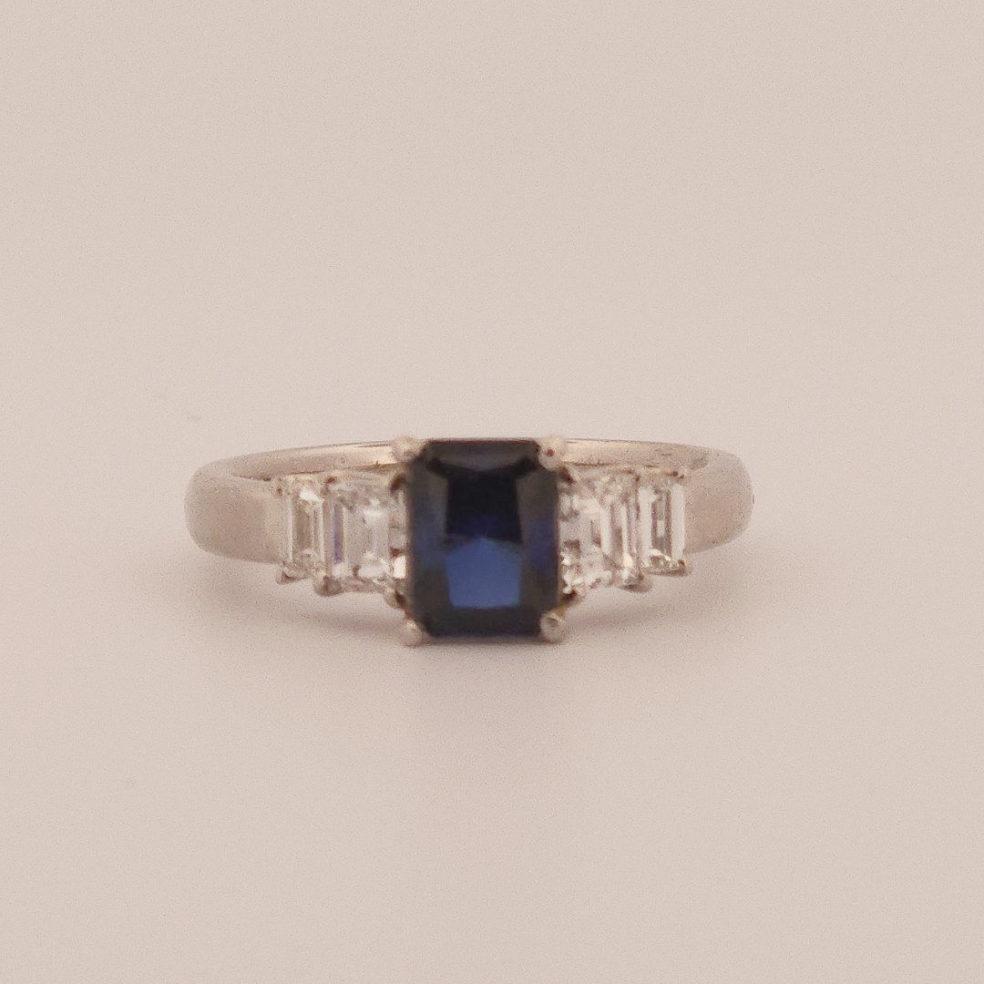 Emerald Step-Cut, AAA Natural Blue Sapphire (1.15CT, 7x5mm), Mounted on Platinum 900 Ring with Natural Diamonds (0.77 CTW, E/F VS1/VS2). Size 7.25