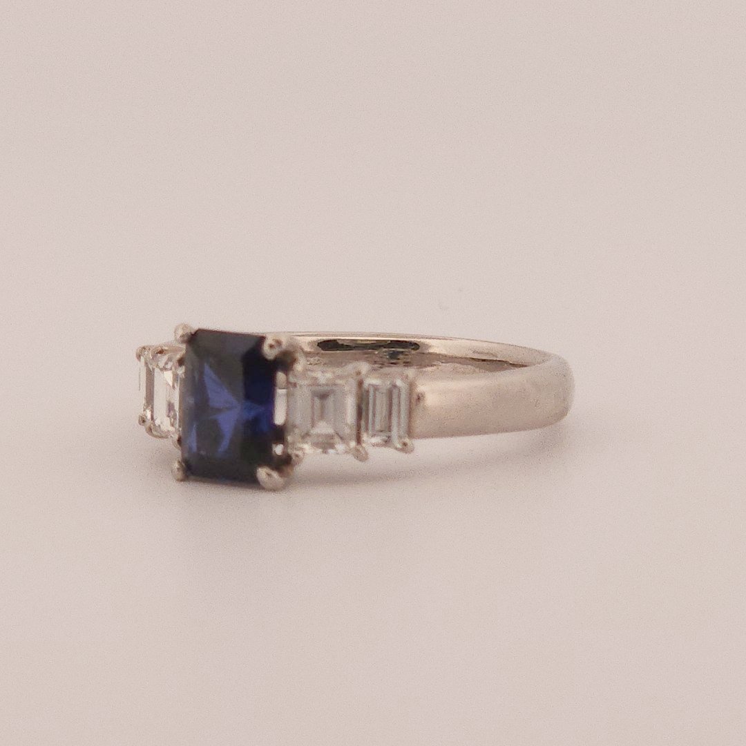 Emerald Step-Cut, AAA Natural Blue Sapphire (1.15CT, 7x5mm), Mounted on Platinum 900 Ring with Natural Diamonds (0.77 CTW, E/F VS1/VS2). Size 7.25