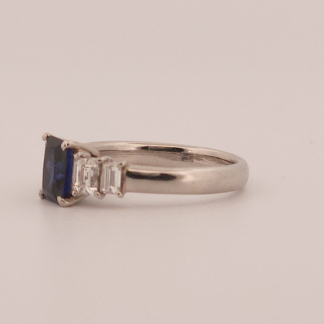Emerald Step-Cut, AAA Natural Blue Sapphire (1.15CT, 7x5mm), Mounted on Platinum 900 Ring with Natural Diamonds (0.77 CTW, E/F VS1/VS2). Size 7.25