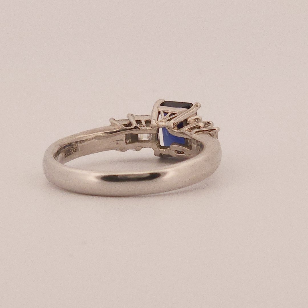 Emerald Step-Cut, AAA Natural Blue Sapphire (1.15CT, 7x5mm), Mounted on Platinum 900 Ring with Natural Diamonds (0.77 CTW, E/F VS1/VS2). Size 7.25