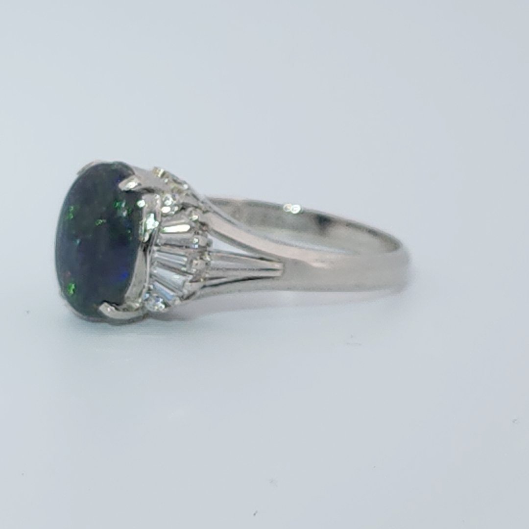 DATA_MISMATCH: Black Opal Ring vs Opal 2.6ct (typical white/translucent) | Platinum Ring, set with 1 Opal (2.6ct, dark/black) and Diamonds (0.485ct total), 8g