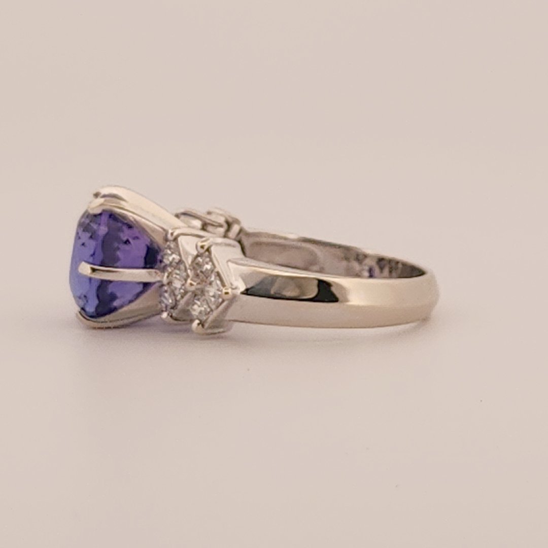 Natural Round Modified Brilliant Cut, Bluish Violet Tanzanite (5.25 CT - 10.20 mm) with 12 Natural Princess cut 3x3 mm Square Diamonds (1.92 CTW) Ring 14K White Gold. GIA Certified (2231466864).